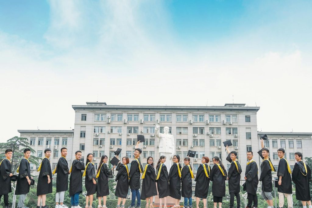 "Graduates celebrating at an accredited tuition-free institution in Nigeria, showcasing the success and diversity of students supported by the Federal Government’s initiatives."